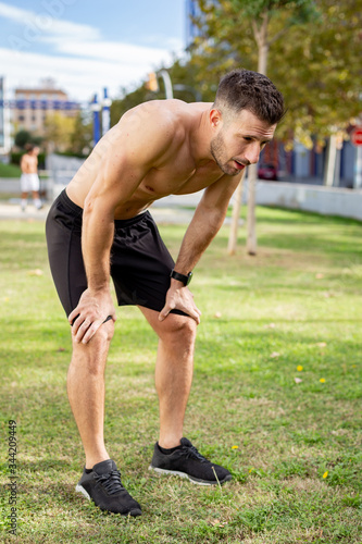 Young Sportsman Resting After Run