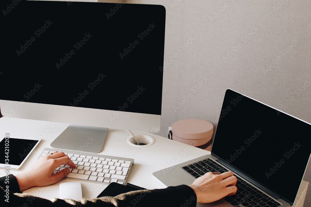 Woman using computer at home workplace Woman using computer at home workplace