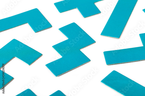Various shapes  blue puzzle elements  pattern  white background abstract. Scattered unorganized parts  simple different unlinked disconnected figures  no connection  solving problems abstract concept