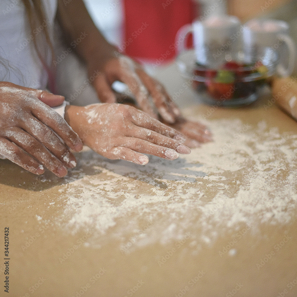 couple in love kneading the dough together