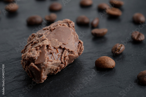 Bilde på lerret two truffle chocolates on a black stone board