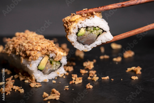 Sushi roll with tuna and avocado, ready to eat