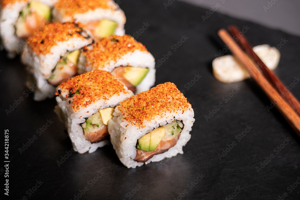 Salmon roll with avocado, sushi ready to eat