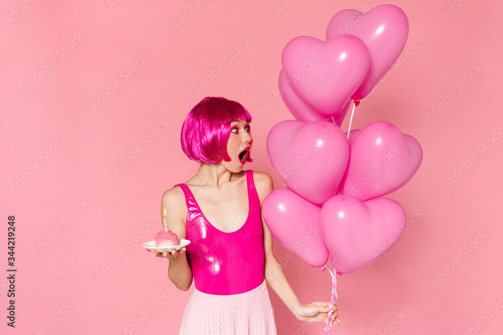 Image of surprised nice woman posing with balloons and cake Image of surprised nice woman posing with balloons and cake