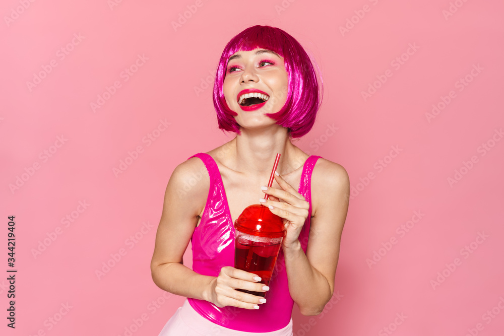 Image of laughing beautiful woman drinking soda from plastic glass Image of laughing beautiful woman drinking soda from plastic glass