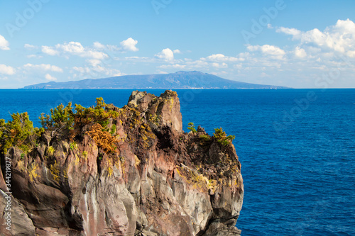 Ocean cliff with Izu-oshima island background in Izu peninsula, Shizuoka, Japan