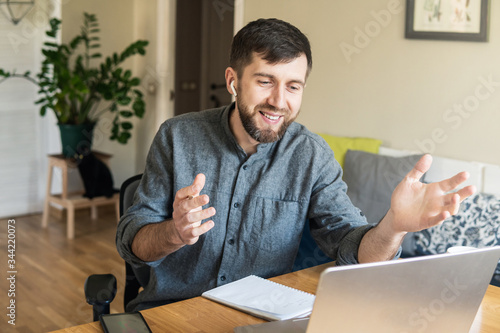 Handsome Eastern European man working from home during Corona virus quarantine
