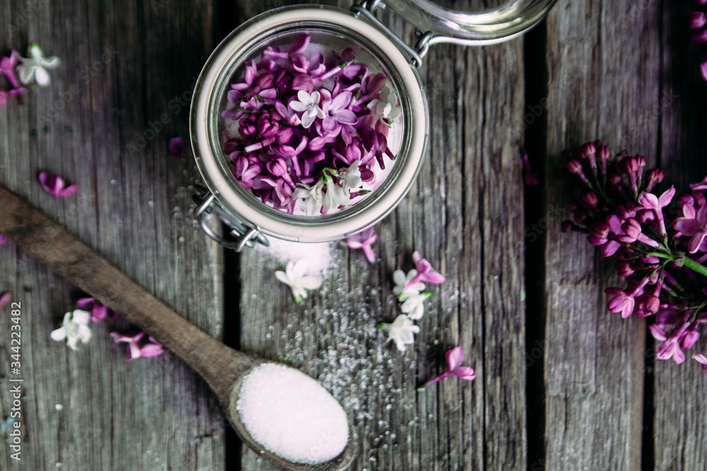Sugar with lilac on a wooden table Sugar with lilac on a wooden table