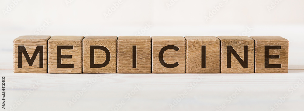 Fototapeta MEDICINE text word on wooden cubes on white background