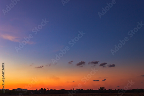 sunset over silhouette countryside 
