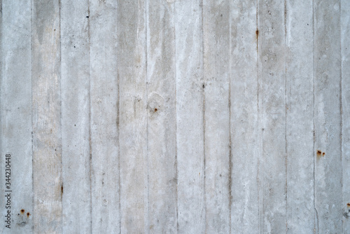 Texture of an old gray concrete wall as background or wallpaper