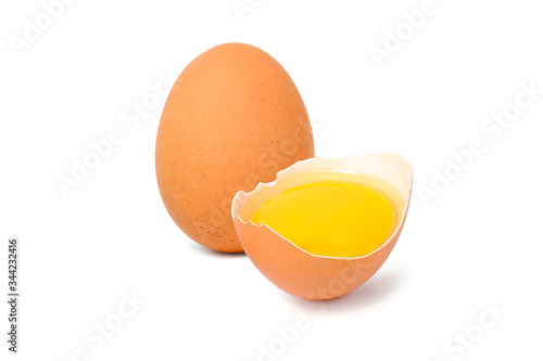 Chicken eggs and half yolk isolated on white background