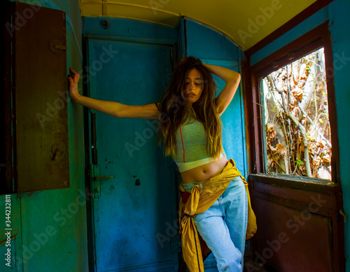 young woman in a train, sexy young girl sitting in a train