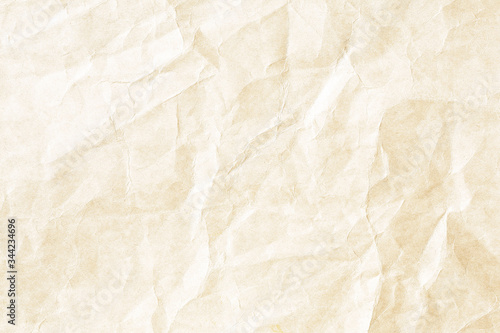 Old pale yellow crumpled paper background texture