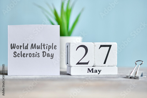 27 twenty seventh World Multiple Sclerosis day May Month Calendar Concept on Wooden Blocks.