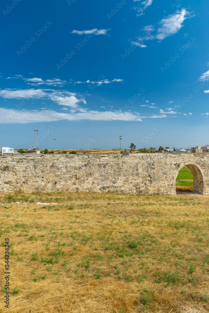 The picturesque ancient aqueduct is located near the city of Larnaca.