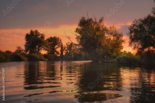 sunset on the quiet Kuban river, which originates from the Caucasus-Elbrus