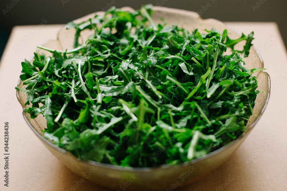 fresh arugula leaves in a plate fresh arugula leaves in a plate