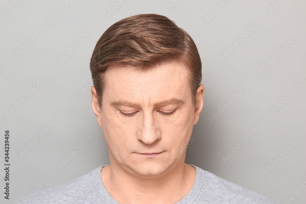 Portrait of blond mature man with neutral calm expression on face Portrait of blond mature man with neutral calm expression on face