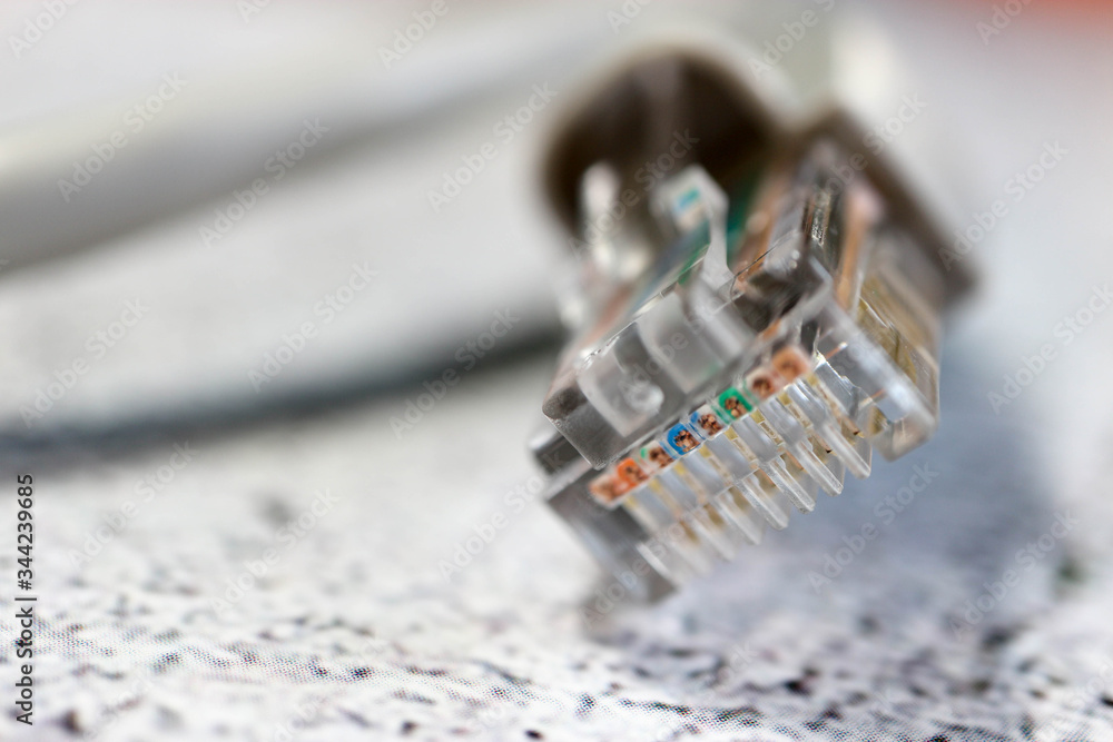 close up of a computer network cable connector registered jack