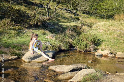 Children in river in English Countryside