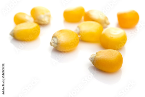 Sack corn seed isolated on white. Sweet Yellow maize kernel - agriculture popcorn background. Concept of healthy food, vegetarianism, cooking corn.