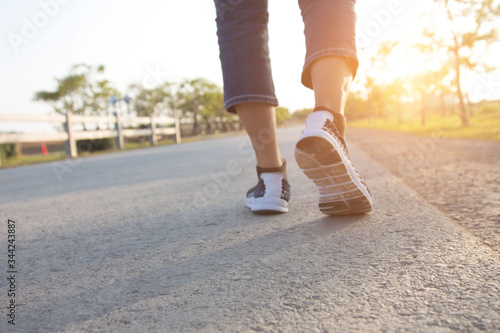 Close up of girl shoes walking in life challenges.walk concept