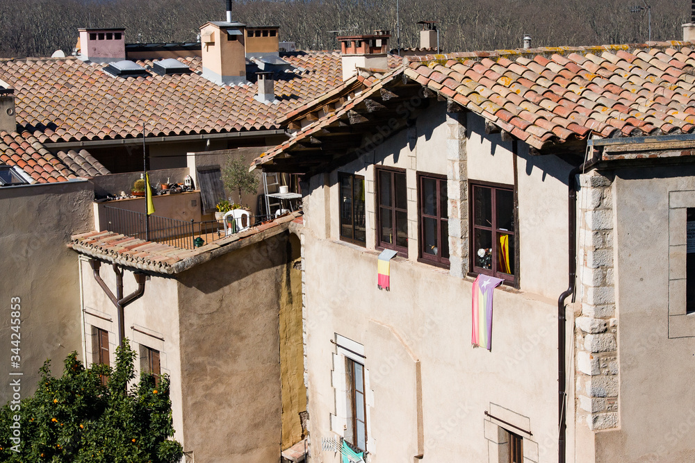 Medvedial houses with tiled roofs in old town in Girona, Catalonia