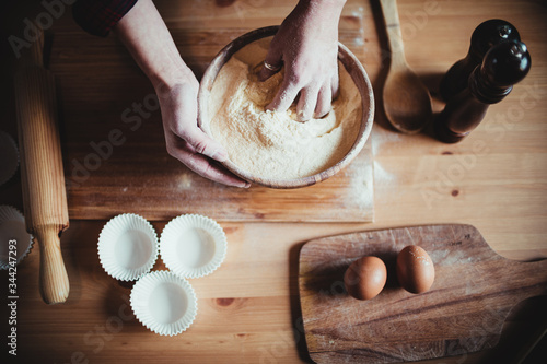 Wallpaper Mural Woman hands mixing flour in a bowl on a table kitchen with eggs 
 Torontodigital.ca