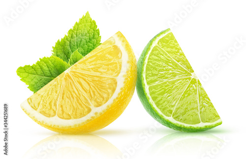 Isolated two citrus fruits slices. Pieces of lemon and lime with mint leaf isolated on white background © ChaoticDesignStudio