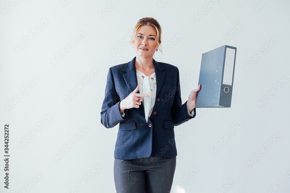 portrait of a businesswoman with paperwork at work in the office portrait of a businesswoman with paperwork at work in the office