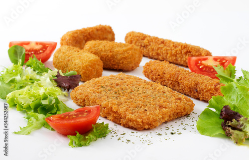 Tasty croquettes on square plate