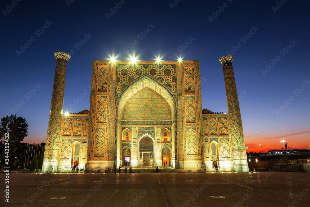 View of Registan square in Samarkand - the main square with Ulugbek madrasah at sunset. Uzbekistan