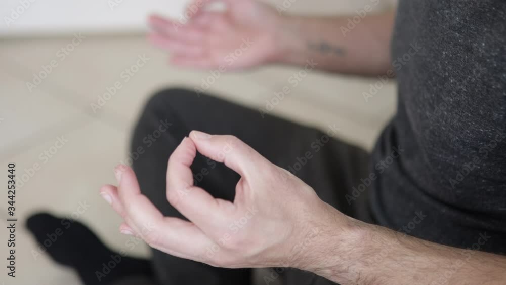 Caucasian man is meditating. Man Hands During Yoga Meditation Caucasian man is meditating. Man Hands During Yoga Meditation