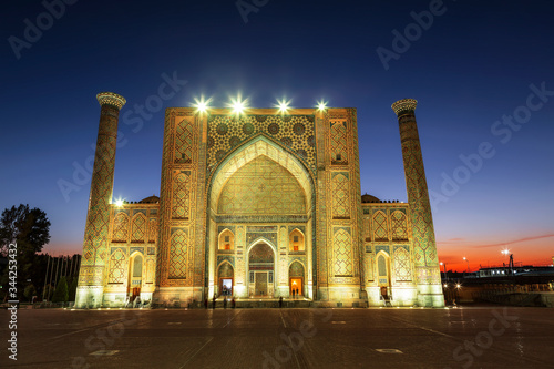 View of Registan square in Samarkand - the main square with Ulugbek madrasah at sunset. Uzbekistan