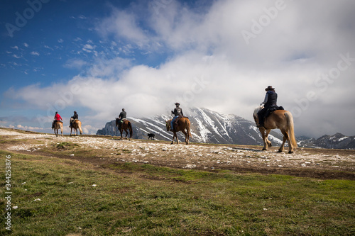 Horse riders on the Montebaldo mountain, Malcesine, Italy photo