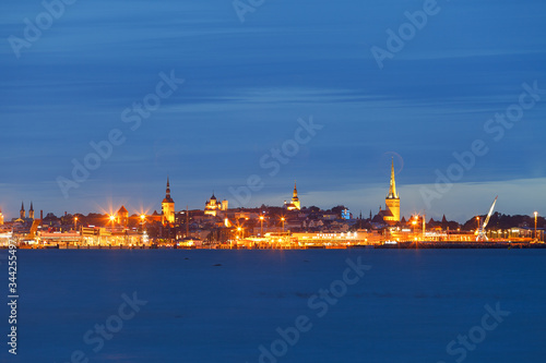 Scenic blue hour view of old town and harbor skyline. Tallinn, Estonia.