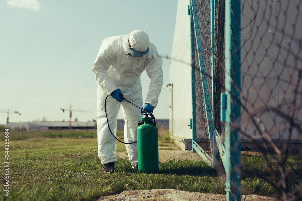 Naklejka premium Cleaning and Disinfection outside around buildings, the corona-virus epidemic.