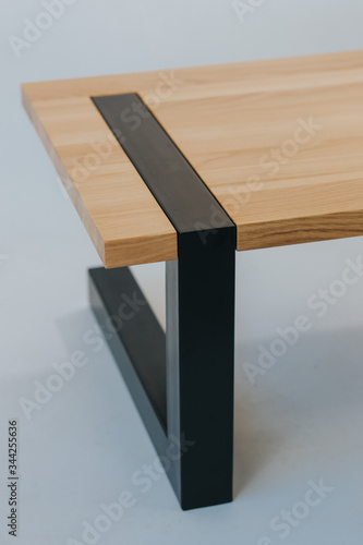 wooden table with metal legs on white background