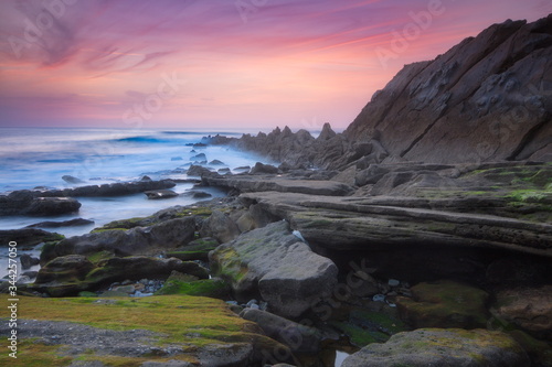 Getxo, Bizkaia/Basque Country; May 16, 2012. Colorful sunset at Azkorri beach at low tide photo