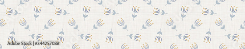 
Seamless tossed floral pattern in french blue linen shabby chic style. Hand drawn country bloom texture. Rustic woven background. Kitchen towel home decor swatch. Simple flower motif all over print