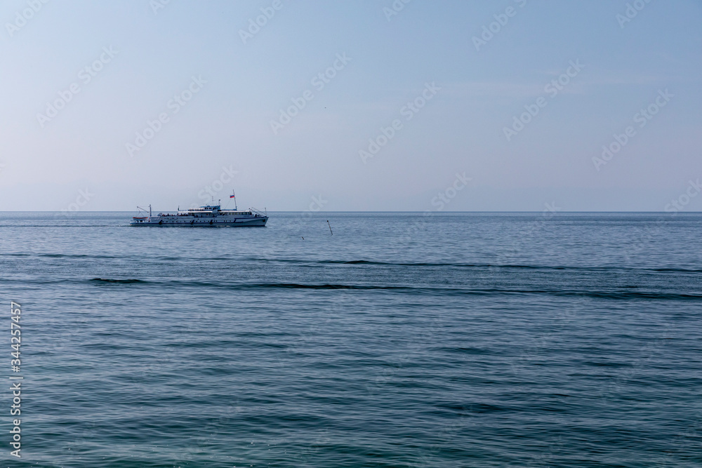 Lake Baikal, cruise ship rides tourists on a Sunny day