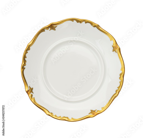 Vintage plate of unusual shape with gold rim isolated. Bowl top view.