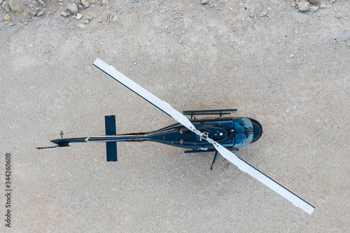 Aerial view of Black Helicopter on a desert ground  