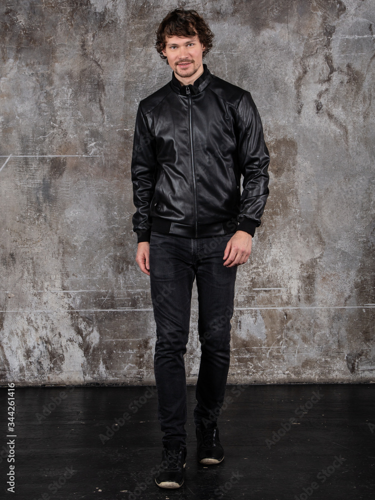 Full length studio portrait of attractive young man. Young Male Fashion Model Posing In Casual Outfit. Full length studio portrait of attractive young man. Young Male Fashion Model Posing In Casual Outfit.
