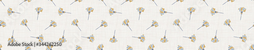 
Seamless tossed floral border pattern. French blue linen shabby chic style. Hand drawn country bloom banner. Rustic woven background. Kitchen towel home decor swatch. Simple flower ribbon trim edge.