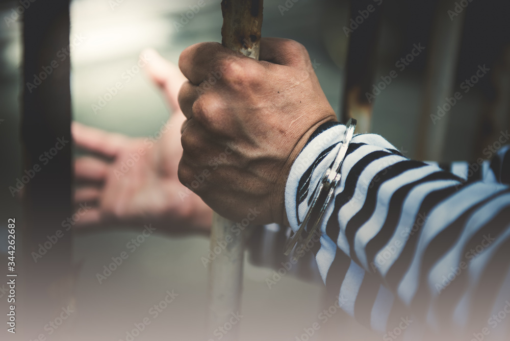 Φωτογραφία Blurred soft images of Male criminals was areested and handcuffed in a dirty cag