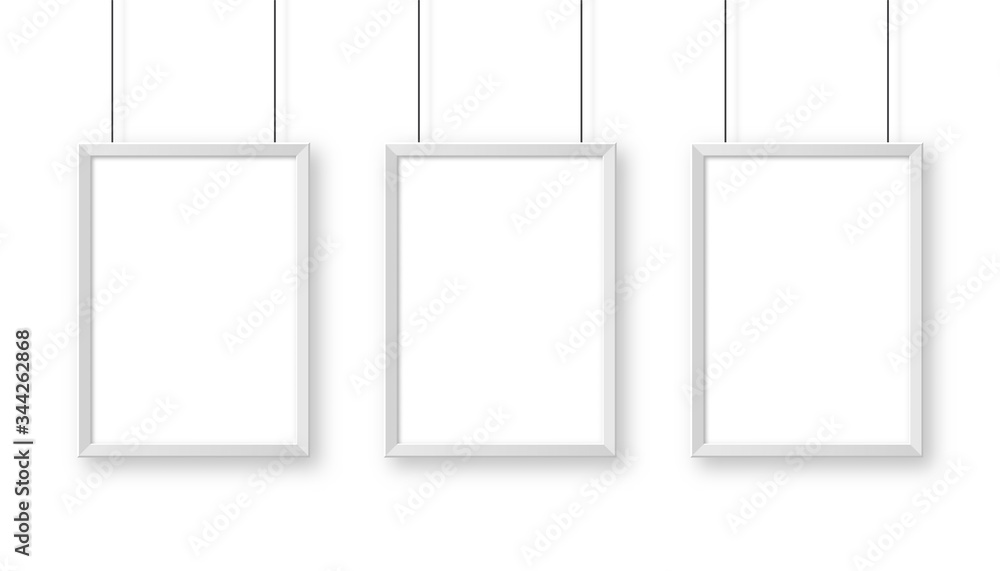 Realistic hanging on a wall white blank picture frame. Modern poster mockup. Empty photo frame. Vector illustration.