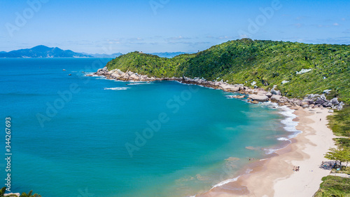 Beautiful aerial view of Tainha beach. Tropical and desert beach of Bombinhas - SC -Brazil © Jair