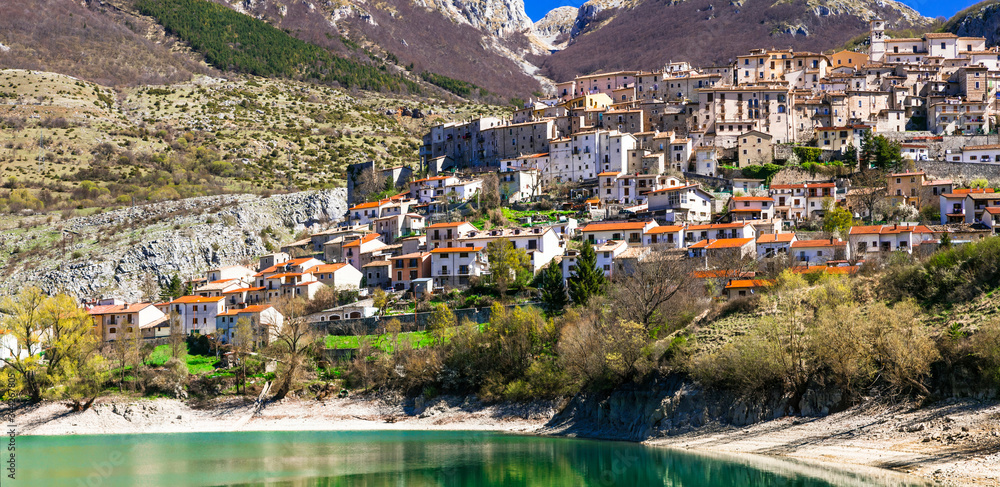 traditional Italy. Beautiful emerald lake in Abruzzo mountains and scenic village. Lago di Barrea